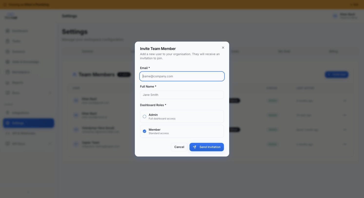 Invite Team Member modal — email + full name + Admin / Member role radio